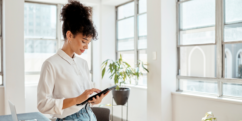 woman looking at tablet