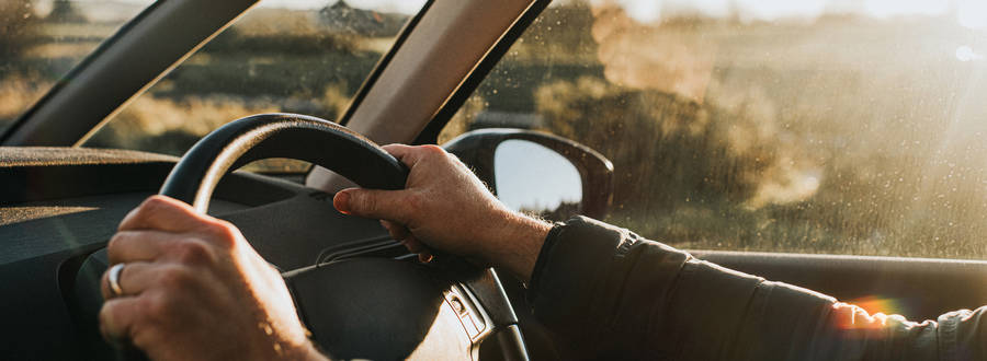 Man Driving A Car